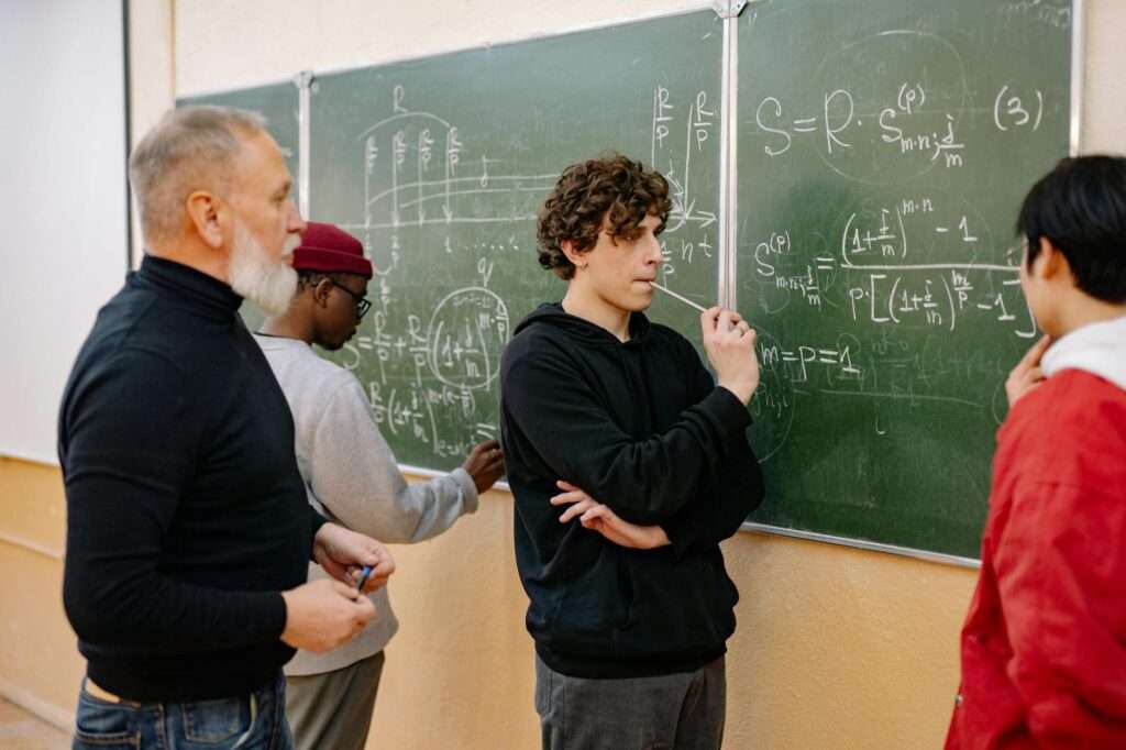 a man writing on the blackboard